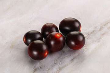 Raw ripe black kumato tomato