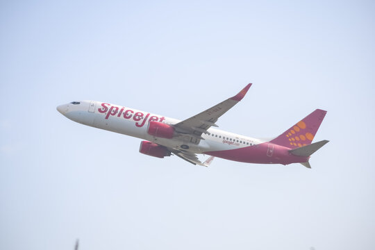 New Delhi, India, April 16 2023 - Spicejet Airbus A320 take off from Indra Gandhi International Airport Delhi, Spicejet domestic aeroplane flying in the blue sky during day time