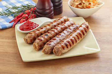 Grilled sausages with cabbage and sauce