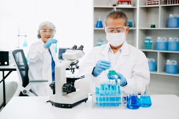 Scientist team meeting and writing analysis results in the laboratory study and analyze scientific sample