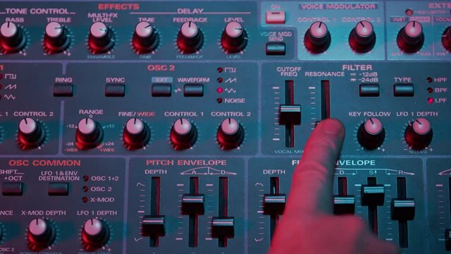 Recording Studio Analog Synthesizer Rack Unit full screen close-up showing faders and knobs, sliders and pots being adjusted.