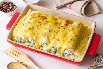 Italian cannelloni with cheese and spinach. Italian food. Vegetarian food.