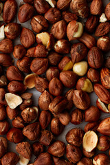 Fresh, young, unroasted hazelnuts or hazelnut kernels. Against the background of a delicate white curtain. Daylight. Natural color.