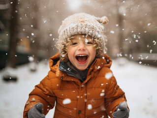 Fototapeta premium A toddler enjoying the winter snow.