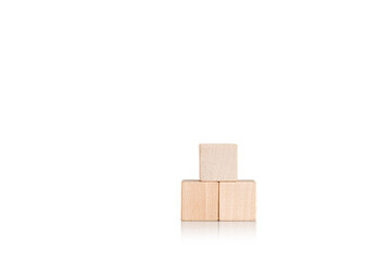 wooden cubes in the form of a pyramid on an isolate white background