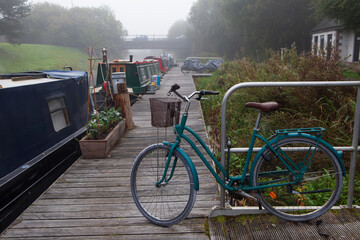 House barges on the Forth and Clyde Canal in Scotland on a cold and misty winters morning 