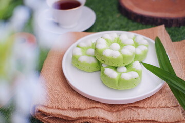 Obraz na płótnie Canvas Kue Putu Ayu, a traditional Indonesian snack made from rice flour, pandan leaves, grated coconut then steamed.