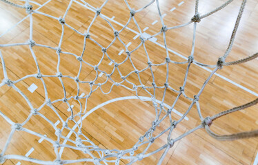Top view of a court through the basketball hoop net © PhotOleh