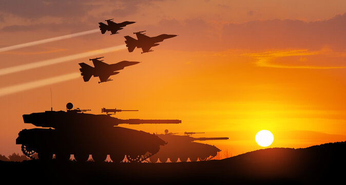 Silhouettes of army tanks and fight planes on background of sunset. Military machinery. Independence day.