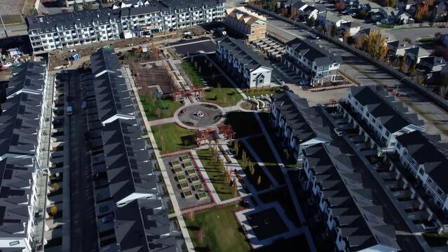 Revealing drone shot of the newly built townhomes in Quarry Park community in Calgary.