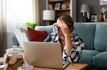 People, accounting, finances, family budget and financial issues concept. Serious young European...