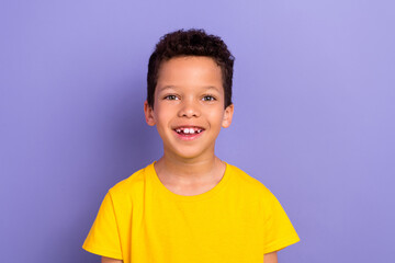Photo of cheerful funky hispanic boy wear yellow clothes have good mood isolated on purple color background
