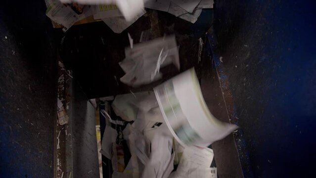 Paper waste sorted on a conveyor belt