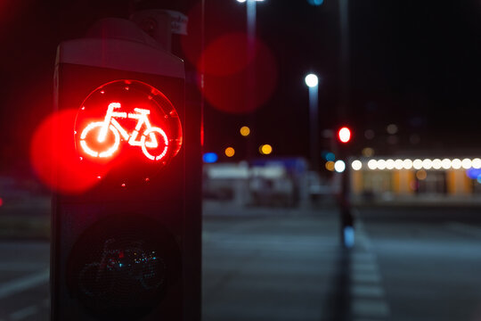 Bicycle stop red warning lamp sign on traffic light road highway driveway drive crossroad intersection evening dark time german city. Bike forward movement prohibited on semaphore signal city street