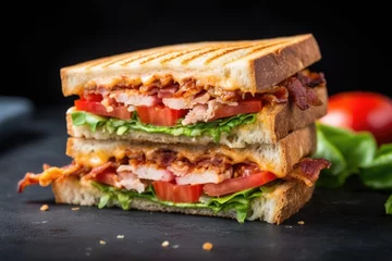 Wandaufkleber a bacon, lettuce, and tomato toasted sandwich on a gray slate © Alfazet Chronicles