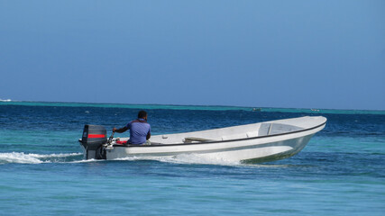 A person riding a boat in Fiji