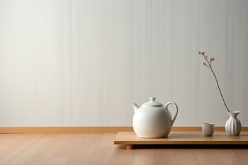 Fototapeta na wymiar a minimalistic, white teapot on a simple wooden table for a minimalist personality