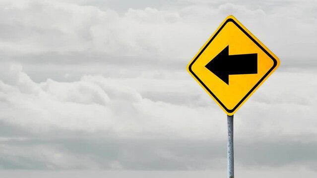 Animation of left side arrow signboard against clouds in the grey sky