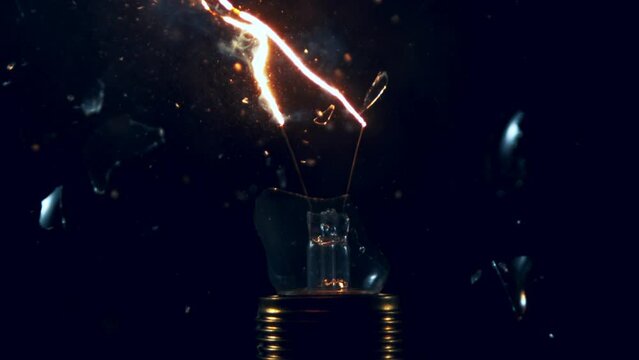 Super slow motion of light bulb explosion isolated on black background. Filmed on super slow motion cinema camera, 2000 fps.