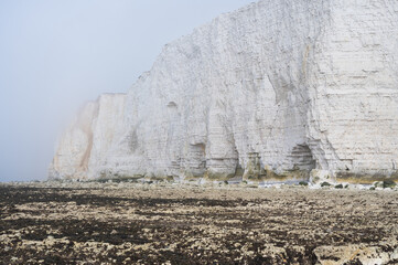 Misty morning in Hope Gap beach, Cuckmere Haven, located between Seaford and Eastbourne. Pebbly...