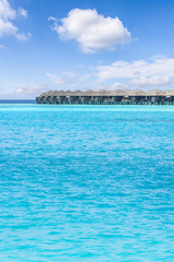 Fototapeta na wymiar Maldives paradise scenery. Tropical aerial landscape, seascape and water villas with amazing sea and lagoon bay, tropical nature. Exotic tourism popular destination banner. Panoramic summer vacation
