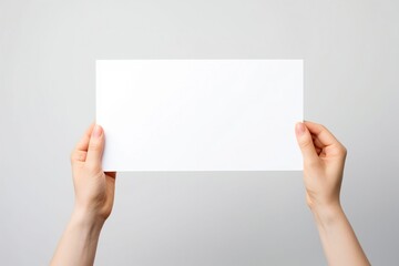 Obraz premium Close Up of Woman's Hand with Blank Paper