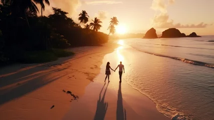 Keuken foto achterwand Anse Source D'Agent, La Digue eiland, Seychellen Couple man and woman walking on the beach of tropical island, at a luxury sunset.