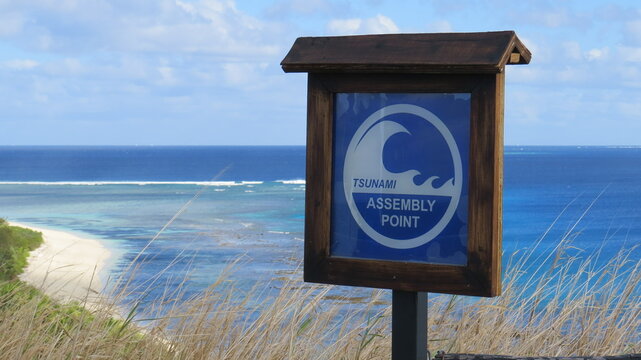 Tsunami assembly point wooden sign in Mana Island, Fiji