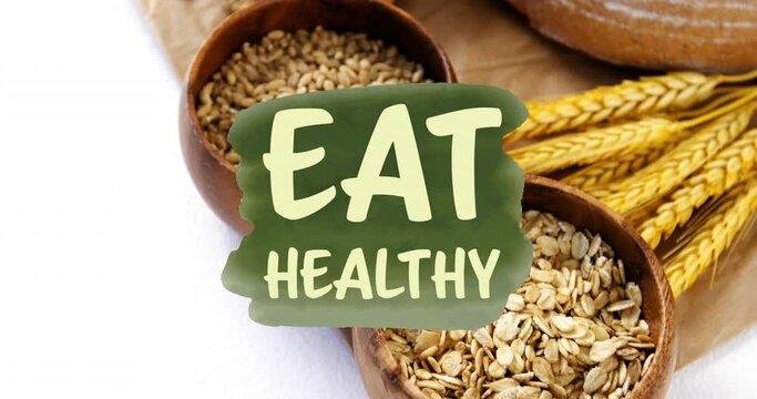 Animation of eat healthy text banner against close up of variety of bread and grains