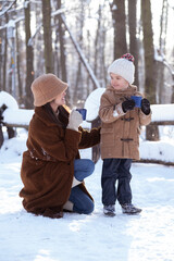 Mom and son have lots of fun taking a winter walk, having tea and decorating the Christmas tree.