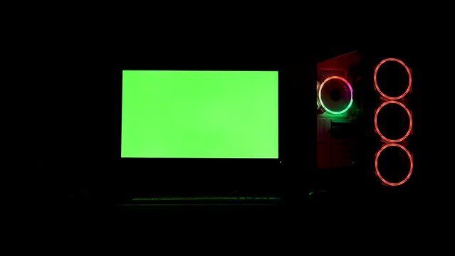 RGB lighting computer pc green screen display in very dark environment