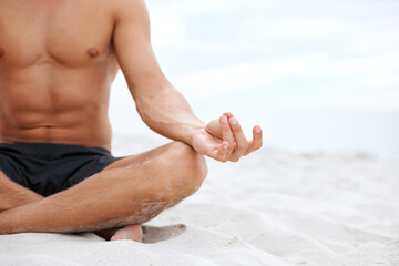 Man, lotus or hand on beach closeup for meditation, zen peace or spiritual practice. Male person, fingers or ocean sand or holistic balance for growth reflection, mind thinking chakra or calm healing