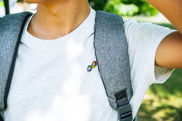 Kid with backpack with autism infinity rainbow symbol sign. World autism awareness day, autism...