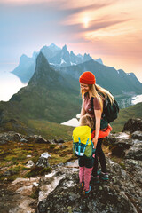 Family travel mother hiking with child in Norway outdoor together healthy lifestyle in Senja mountains active vacations daughter hugging mom Mother's day holiday - obrazy, fototapety, plakaty