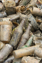 Glass bottles and other rubbish scraps  removed from the seabed by divers. Recycling