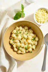 Potato gnocchi with parmesan cheese and greens