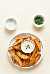 Oven baked potato wedges with sauce