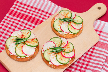Light Breakfast or Diet Eating - Crispy Cracker Sandwich with Cream Cheese, Fresh Cucumber and...
