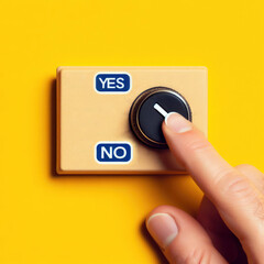 Hand adjusting the volume selector for choosing YES or NO on isolated yellow background. Questionnaire question and answer concept.