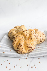 Fresh buns with sesame and flax. on a white background. Baking