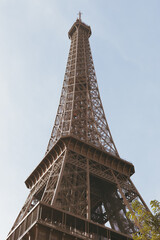 
The iconic Eiffel Tower stands tall, its intricate iron lattice bathed in golden sunlight, a symbol of Parisian elegance and a testament to human architectural genius.