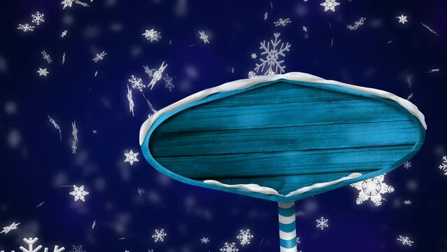 Animation of snow falling over blue sign with copy space on blue background