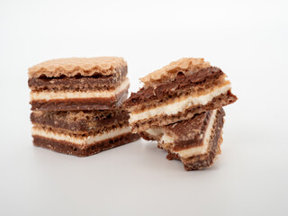 Delicious chocolate wafers with hazelnuts on a white background. Wafers with chocolate and nuts.