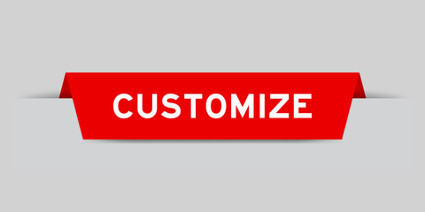 Red color inserted label with word customize on gray background