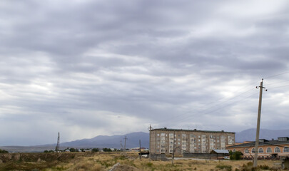 Fototapeta premium Overcast sky with dark clouds. Dark sky before a thunder-storm. The gray cloud background before rain.