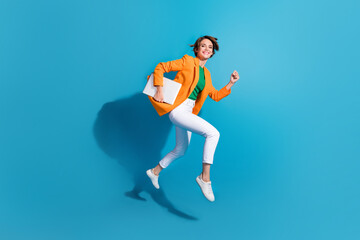 Photo of cheerful active lady entrepreneur manager wear trendy suit go fast hurry office isolated on blue color background - obrazy, fototapety, plakaty
