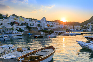Townscape of Lacco Ameno in Ischia Island. View of tourist port at sunset. - obrazy, fototapety, plakaty