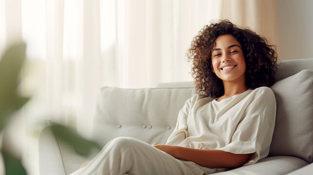 HISPANIC YOUNG WOMAN IN A RELAXED POSE RESTING ON A COMFORTABLE SOFA. HORIZONTAL IMAGE. image created by legal AI