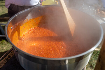 Process of making Balkan food by roast red pepper, spread called Ajvar, traditional prepare.