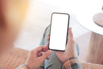 cell phone blank white screen mockup.hand holding texting using mobile on desk at office.background empty space for advertise.work people contact marketing business,technology